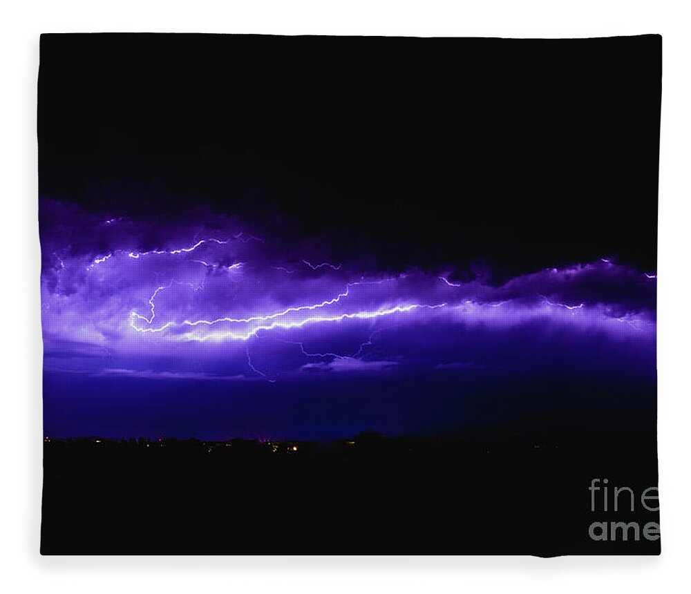 Background Fleece Blanket featuring the photograph Rays in a night storm with light and clouds. by Joaquin Corbalan