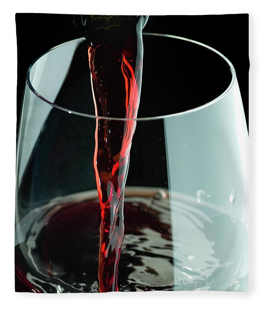 Alcohol Fleece Blanket featuring the photograph Red Wine Being Poured In A Glass by Juanmonino