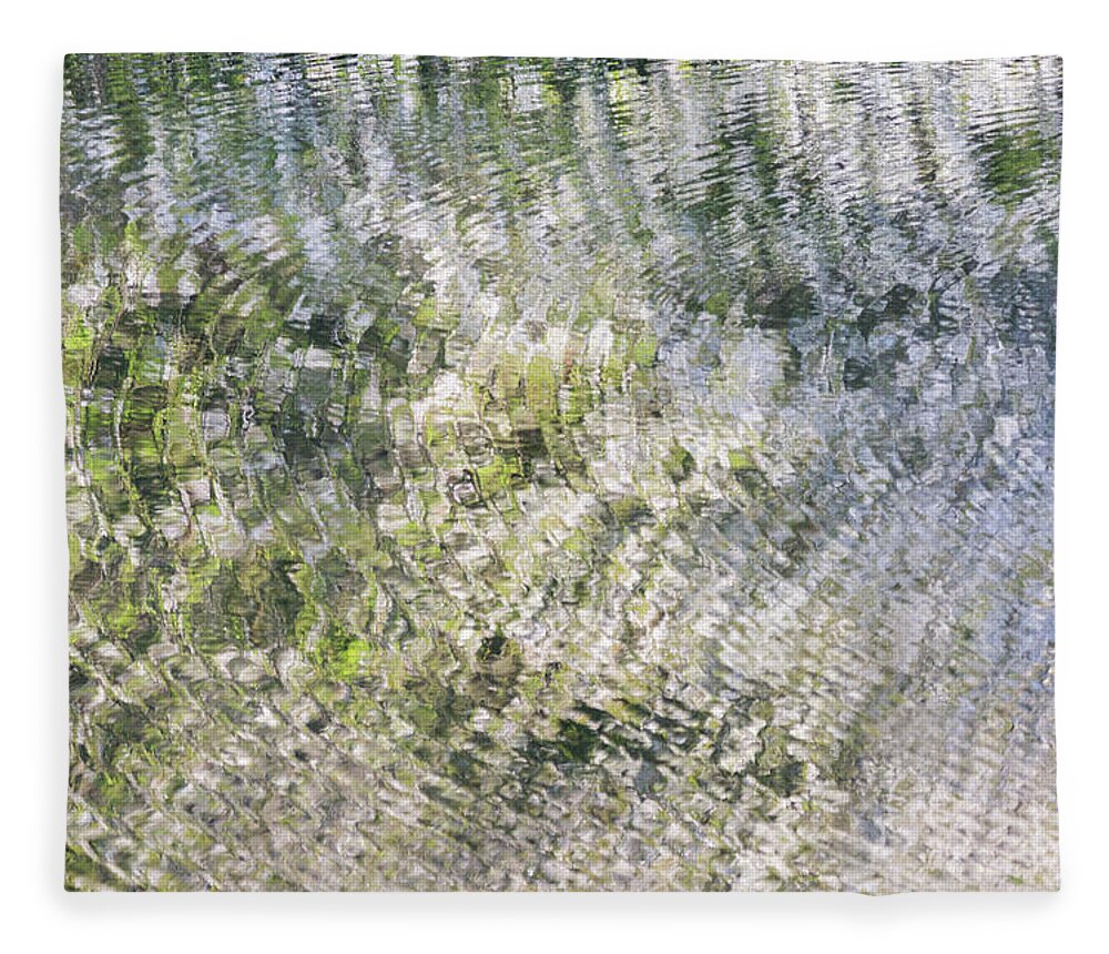 Ripples Fleece Blanket featuring the photograph Ripples on the river with blossom reflections by Anita Nicholson