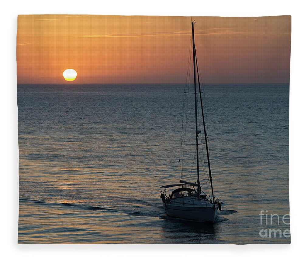 Flying Fleece Blanket featuring the photograph Sailboat Heading Home at Sunset Cadiz Spain by Pablo Avanzini