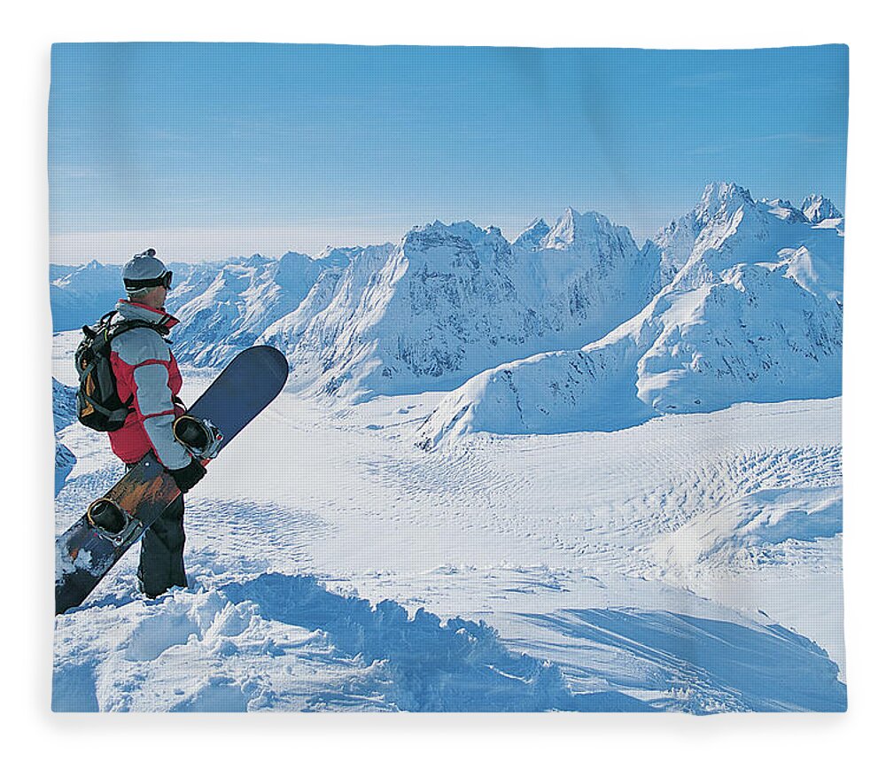Three Quarter Length Fleece Blanket featuring the photograph Side View Of A Snowboarder Looking At by Digital Vision.