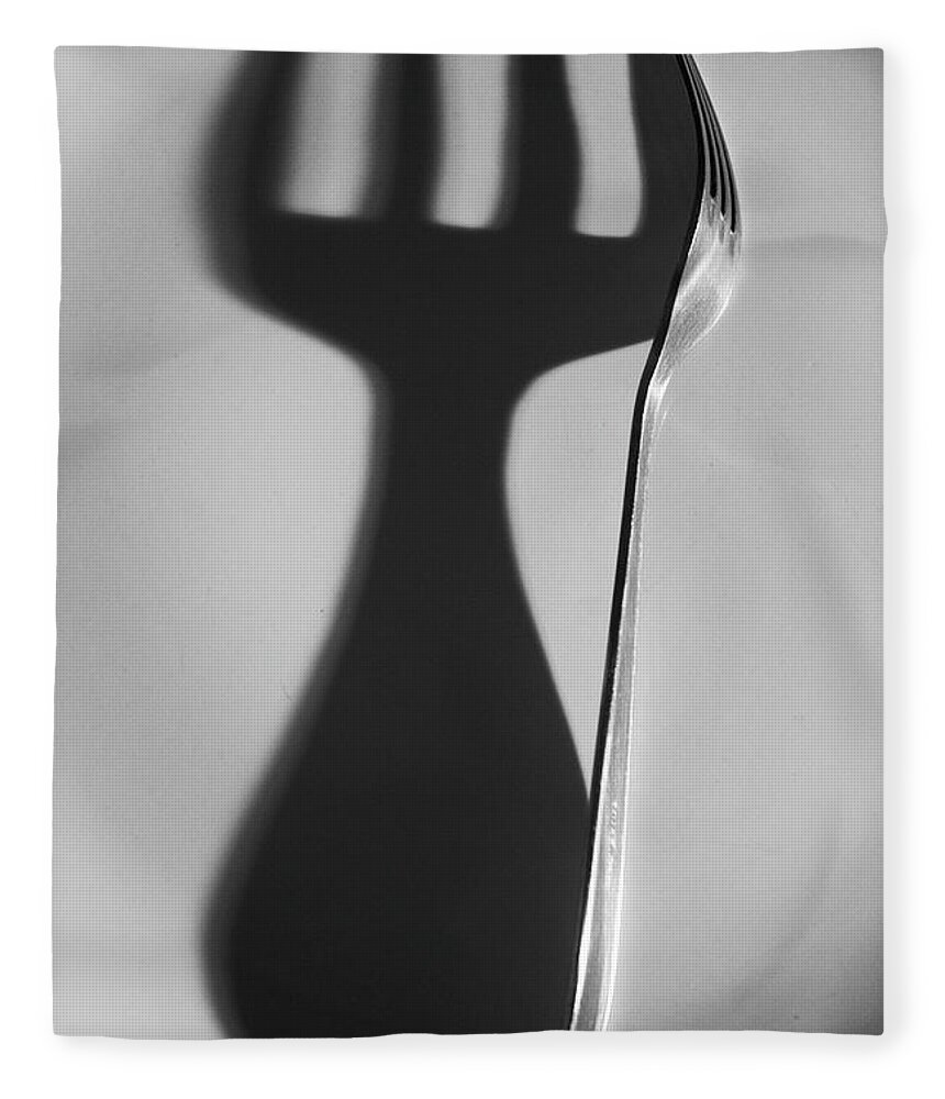 Shadow Fleece Blanket featuring the photograph Steel Fork And Its Shadow On Plate by Neus Pastor