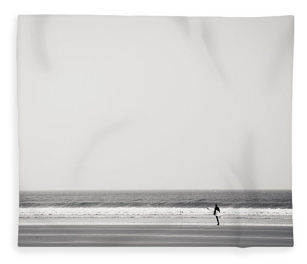 Tranquility Fleece Blanket featuring the photograph Surfer At Newgale Beach, Wales by Elaine W Zhao
