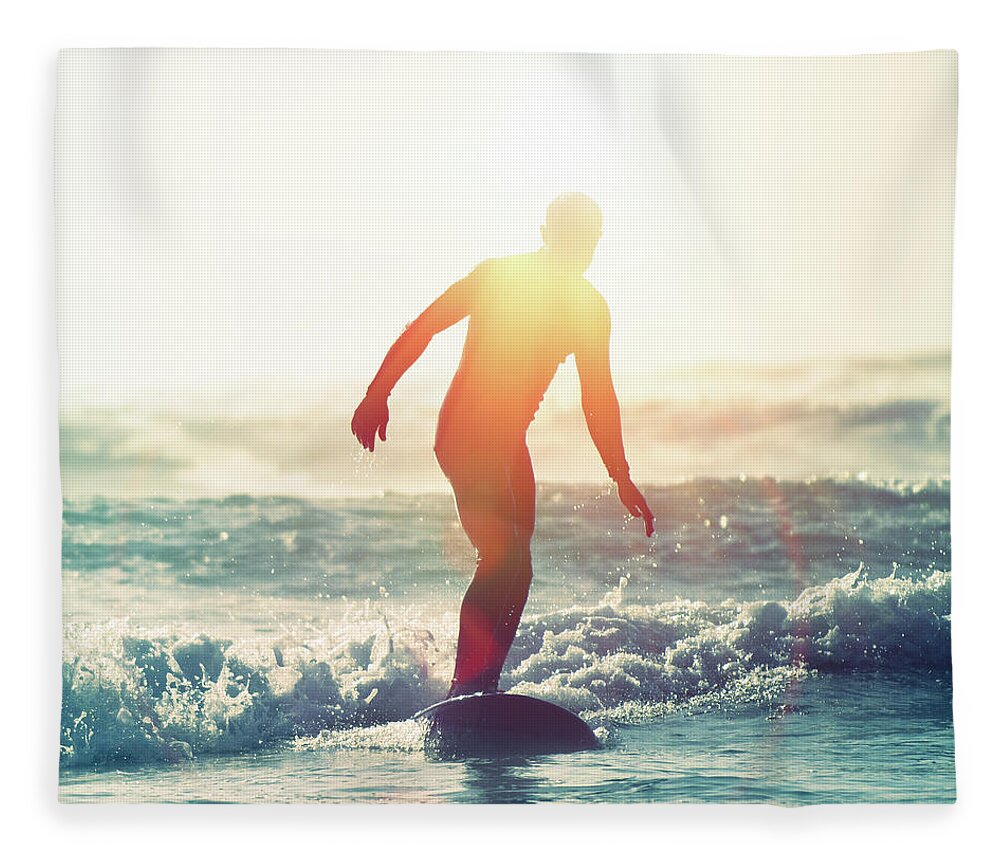 People Fleece Blanket featuring the photograph Surfing Sunflare by Paul Mcgee