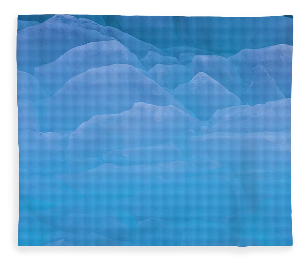 Extreme Terrain Fleece Blanket featuring the photograph The Contours Of Ice On The Surface Of by Mint Images - Art Wolfe