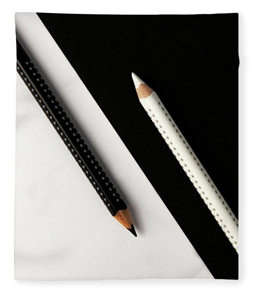Pencil Fleece Blanket featuring the photograph Two drawing pencils on a black and white surface. by Michalakis Ppalis