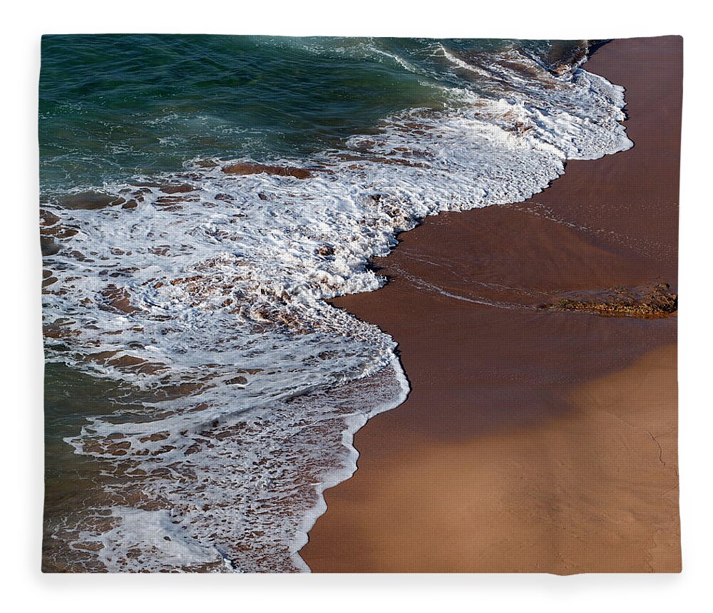 Water's Edge Fleece Blanket featuring the photograph Waves On A Red Sand Beach by Julio Lopez Saguar