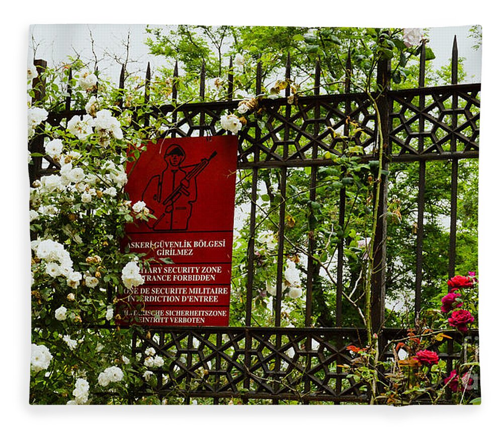 Fences Fleece Blanket featuring the photograph When the roses won the war by Yavor Mihaylov