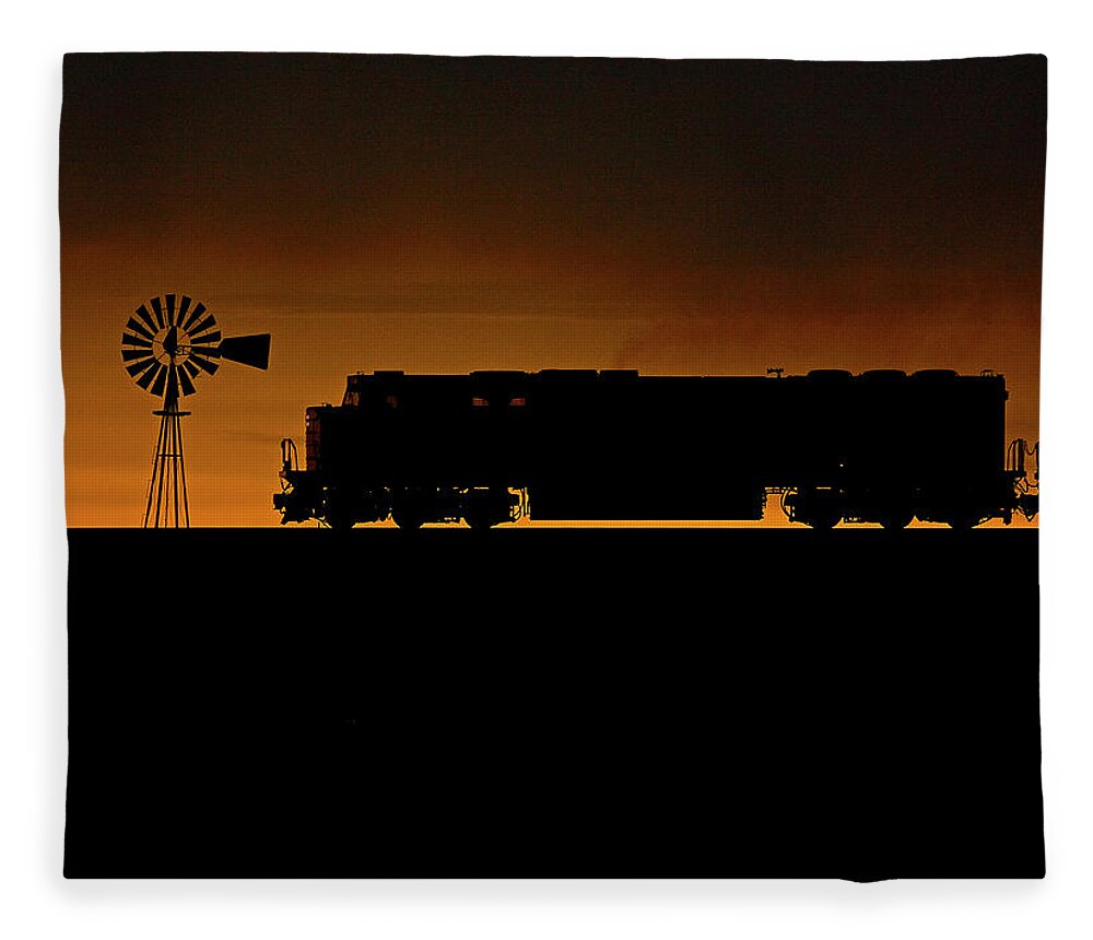 Train Fleece Blanket featuring the photograph Wyoming Sunset With A Train by Tom Danneman