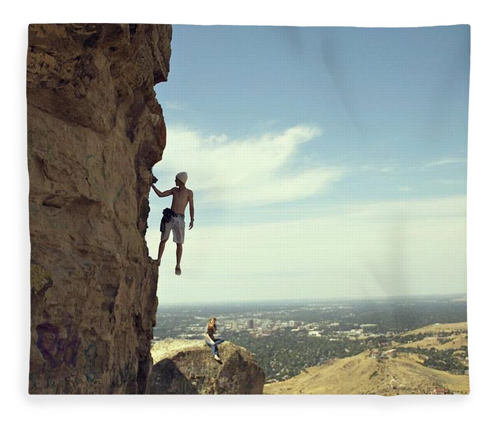 Young Men Fleece Blanket featuring the photograph Young Man Climbs While Girl Looks On by Marit Photography