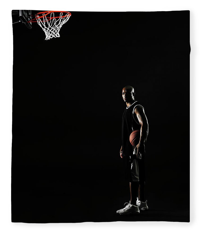 One Man Only Fleece Blanket featuring the photograph Young Man Holding Basketball Beneath by Thomas Barwick