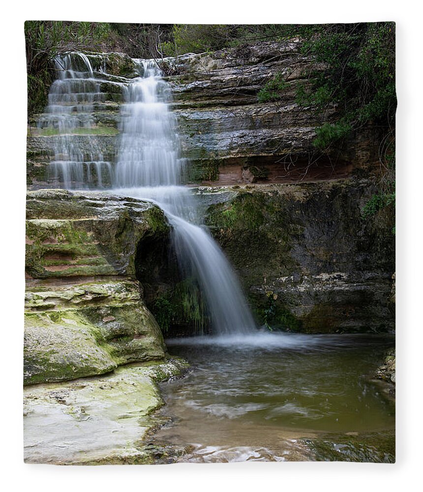 River Fleece Blanket featuring the photograph Beautiful waterfall splashing in the canyon creating a small lake #1 by Michalakis Ppalis