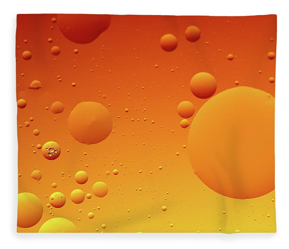 Connection Fleece Blanket featuring the photograph Bright abstract, yellow background with flying bubbles by Michalakis Ppalis