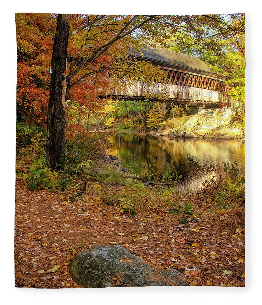 The Gorgeous Henniker Covered Bridge On A Beautiful Fall Day In October Seen Throuh The Woods. Henniker Fleece Blanket featuring the photograph Covered Bridge in Autumn #1 by Donna Doherty