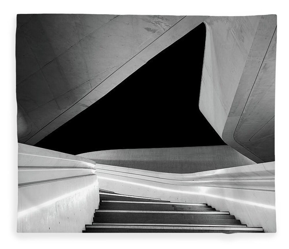 Futuristic Building Fleece Blanket featuring the photograph Modern architecture and empty staircase leading to a bright open space. by Michalakis Ppalis