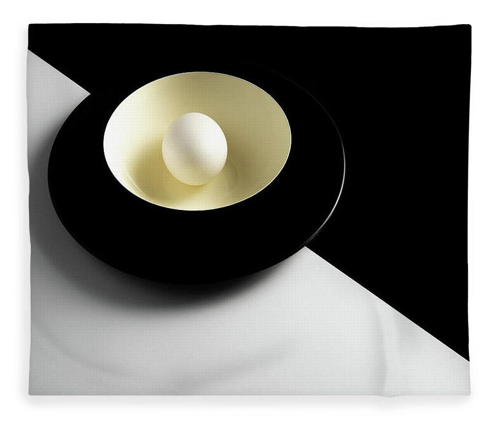 Still-life Fleece Blanket featuring the photograph Single fresh white egg on a yellow bowl by Michalakis Ppalis