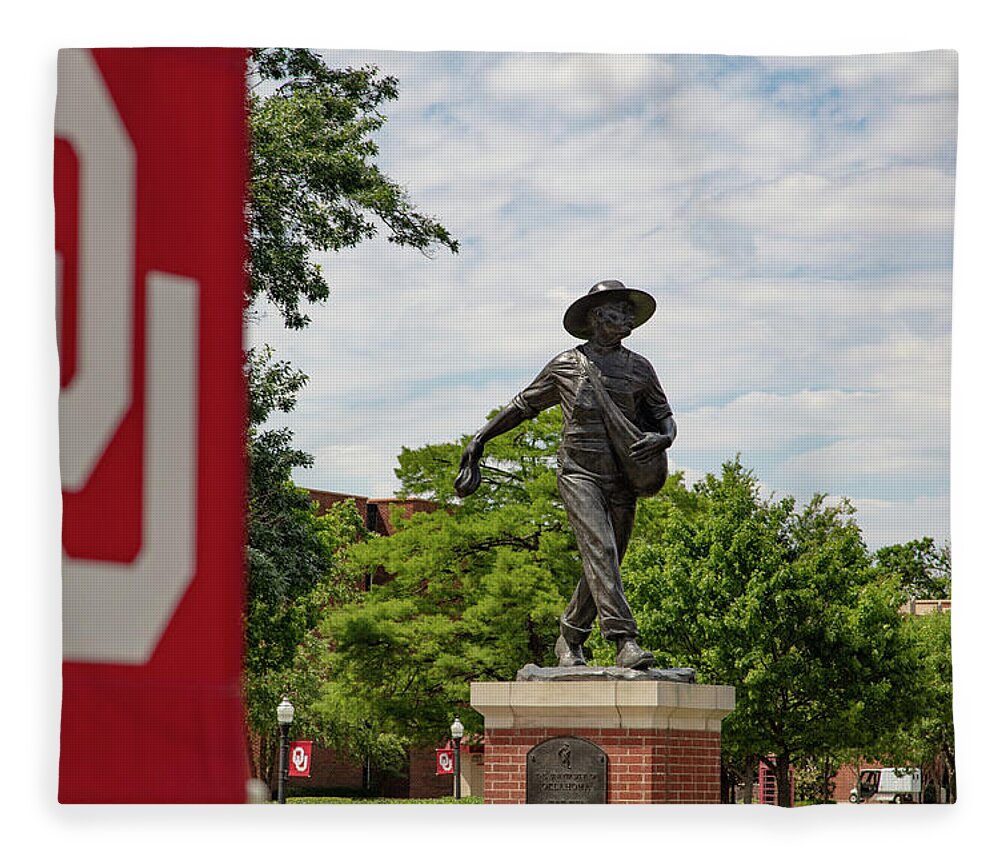 Big 12 Fleece Blanket featuring the photograph Sower Statue on the campus of the University of Oklahoma #1 by Eldon McGraw
