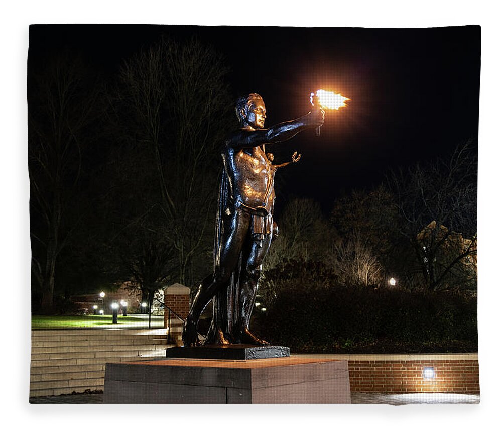 University Of Tennessee At Night Fleece Blanket featuring the photograph Torchbearer statue at the University of Tennessee at night by Eldon McGraw