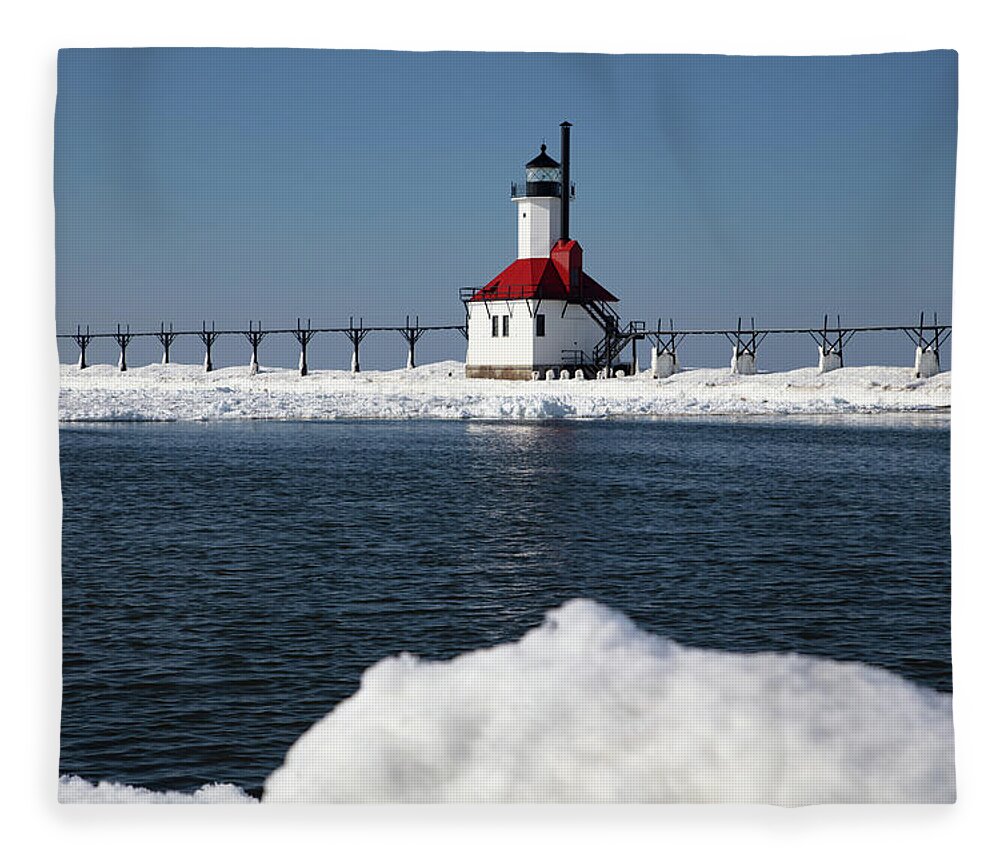 Lake Michigan Lighthouse Fleece Blanket featuring the photograph St. Joseph Lighthouse in St. Joseph, Michigan along Lake Michigan in the winter by Eldon McGraw