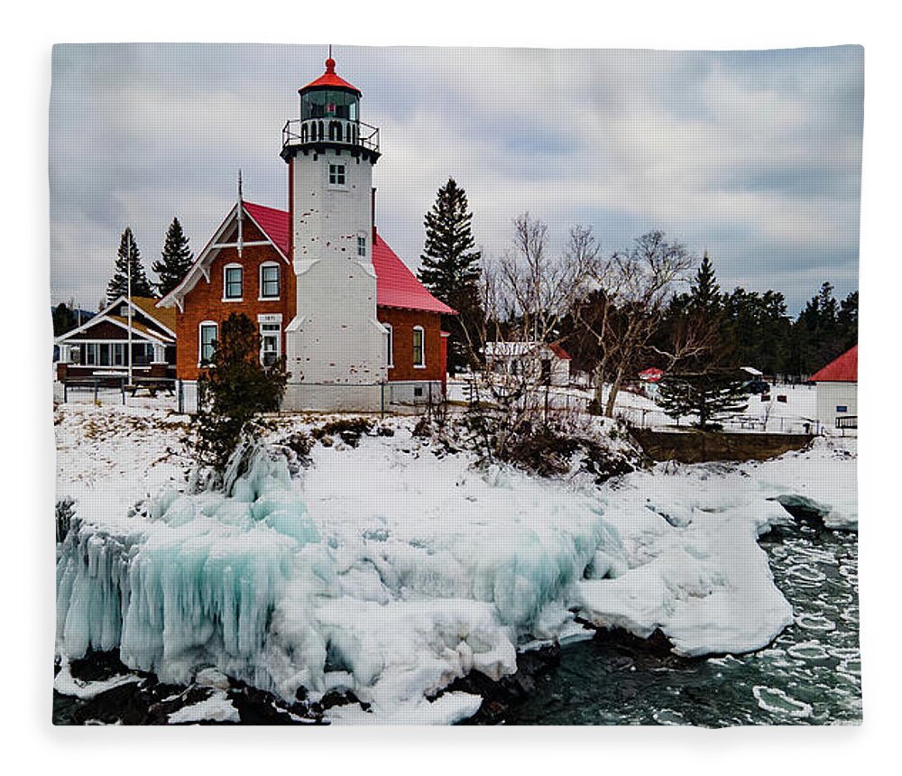 Eagle Harbor Mi Fleece Blanket featuring the photograph Winter view of Eagle Harbor Lighthouse in Eagle Harbor Michigan by Eldon McGraw