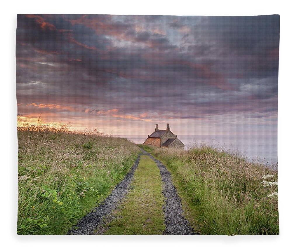 Northumberland Fleece Blanket featuring the photograph A cottage by the sea by Anita Nicholson
