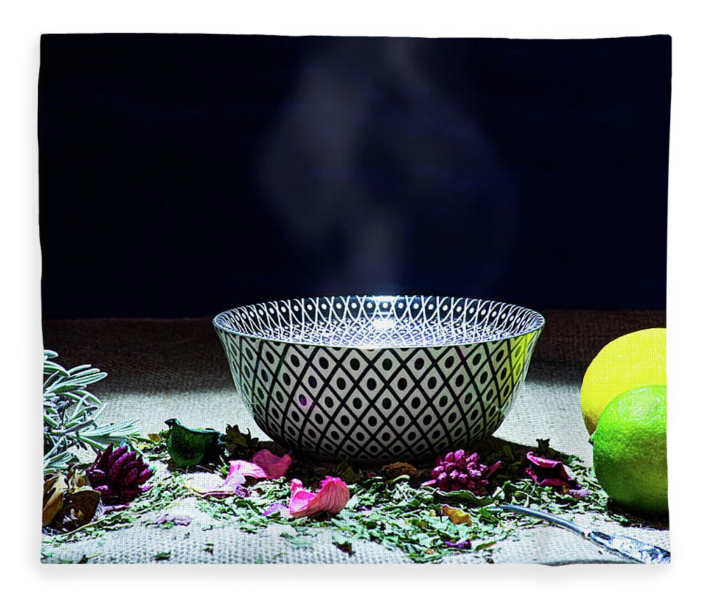 Tea Fleece Blanket featuring the photograph A drinking bowl with tea and herbs. by Bernhard Schaffer