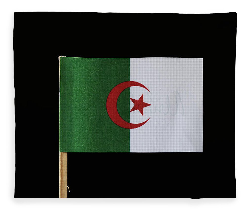 Algeria Fleece Blanket featuring the photograph A original and official flag of Algeria on toothpick on black background. Consists of two equal vertical bars, green and white with a red star and crescent by Vaclav Sonnek
