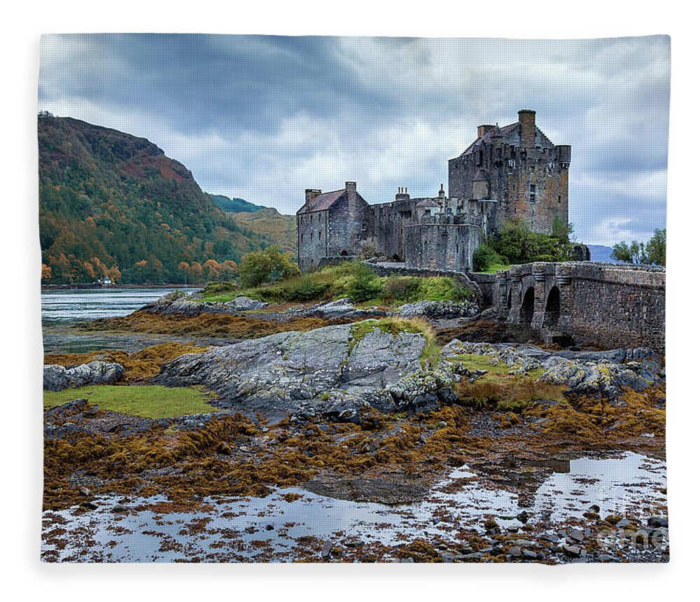 Castle Fleece Blanket featuring the photograph A storm brews over Eilean Donan Castle, Scotland by Jane Rix