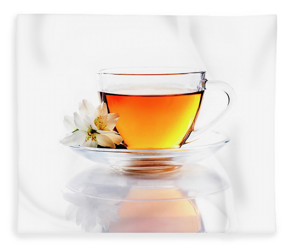 Tea Fleece Blanket featuring the photograph Asian green tea with jasmine flower in transparent teacup isolat by Jelena Jovanovic