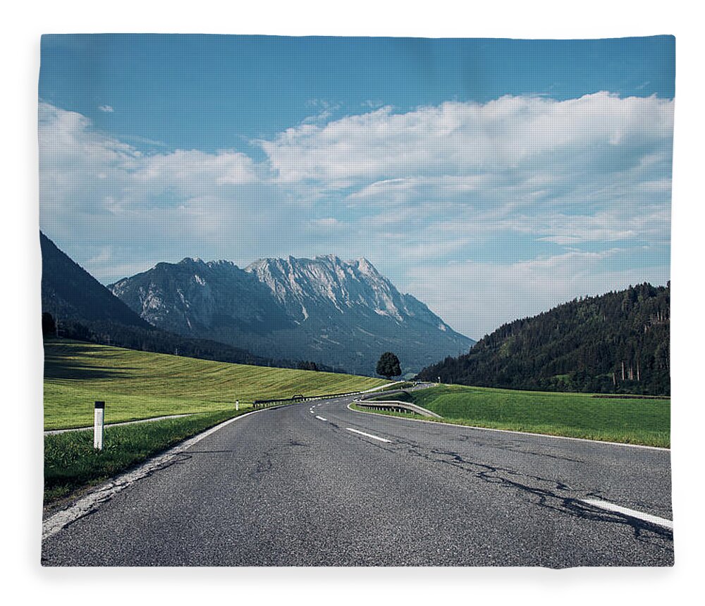 Overcast Fleece Blanket featuring the photograph Asphalt road in Schladming by Vaclav Sonnek