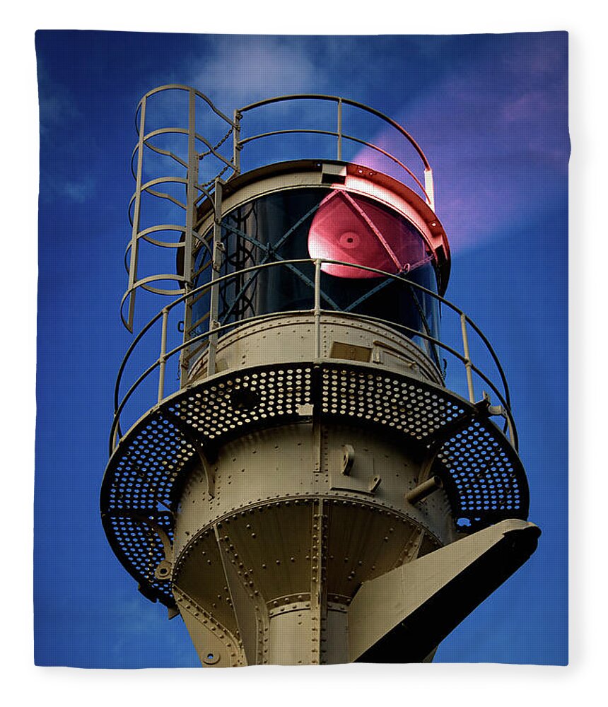 Lighthouse Fleece Blanket featuring the photograph Beam of light from a lighthouse. by Bernhard Schaffer