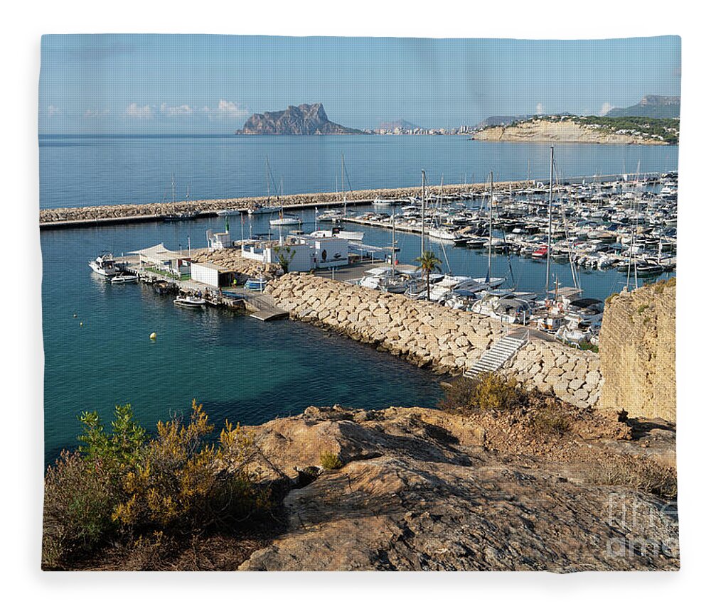 Mediterranean Coast Fleece Blanket featuring the photograph Blue Mediterranean Sea and marina in Moraira 1 by Adriana Mueller