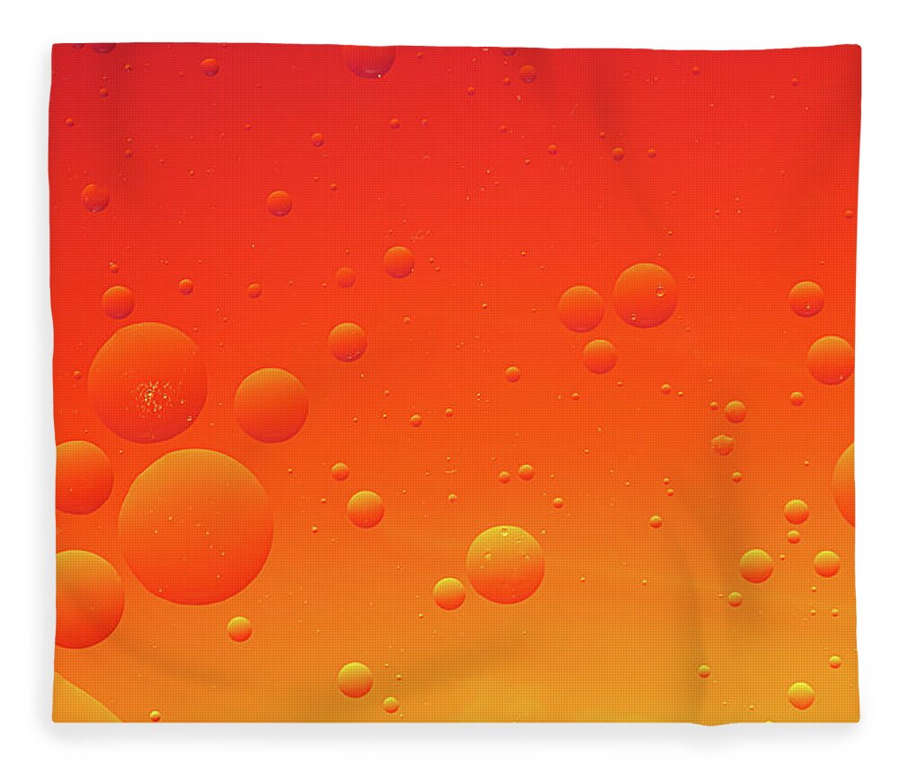 Abstract Fleece Blanket featuring the photograph Bright abstract, red background with flying bubbles by Michalakis Ppalis