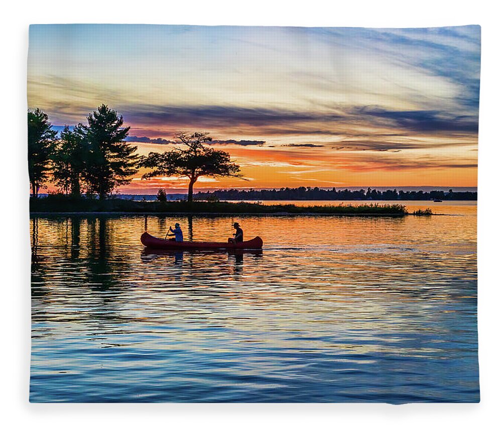 Higgins Lake Fleece Blanket featuring the photograph Canoe at Sunset by Joe Holley