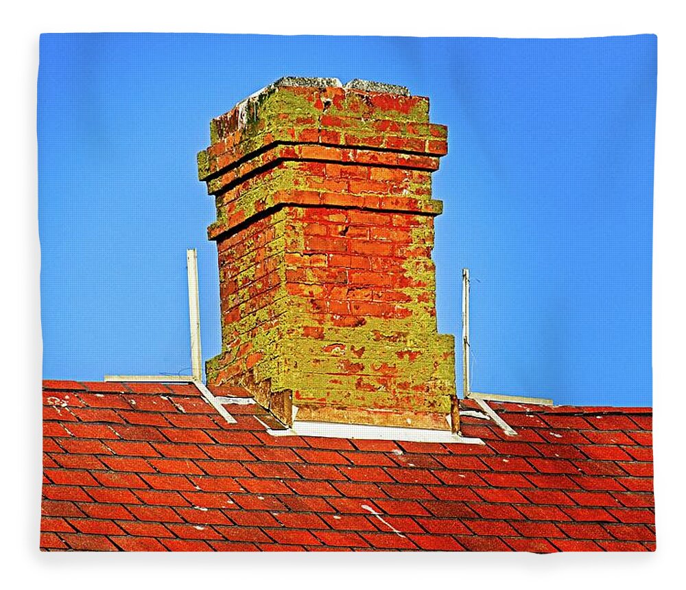 Standing; Chimney; Roof; Peak; Spire; Steeple; Aqua; Black; Blue; Blue Sky; Green; Red; Alone; Old; Rough; Worn; Worn Out; Fungus; Moss; Mold; Bright; Sunny; Sunshine; Bird Droppings; Brick; Droppings; Hard; Metal; Shingle; Surface; Texture; Tile; Above; Building; Close Up; High; House; Sky; Block; Elongated; Layered; Pattern; Peaked; Protruded; Rectangle; Repeated; Sloped; Square; Steep; Terraced; Vertical; Day; Clear Fleece Blanket featuring the photograph Chimney On Blue by David Desautel