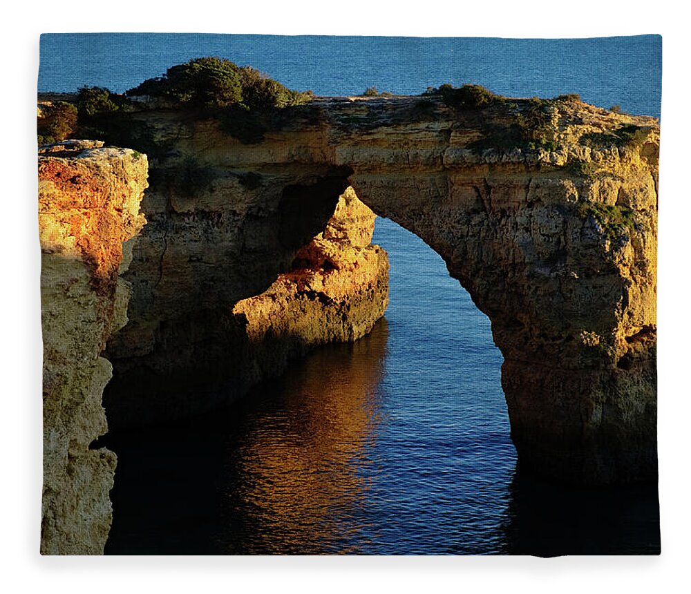 Algarve Fleece Blanket featuring the photograph Cliff Arch in Albandeira Beach during Sunset 2 by Angelo DeVal