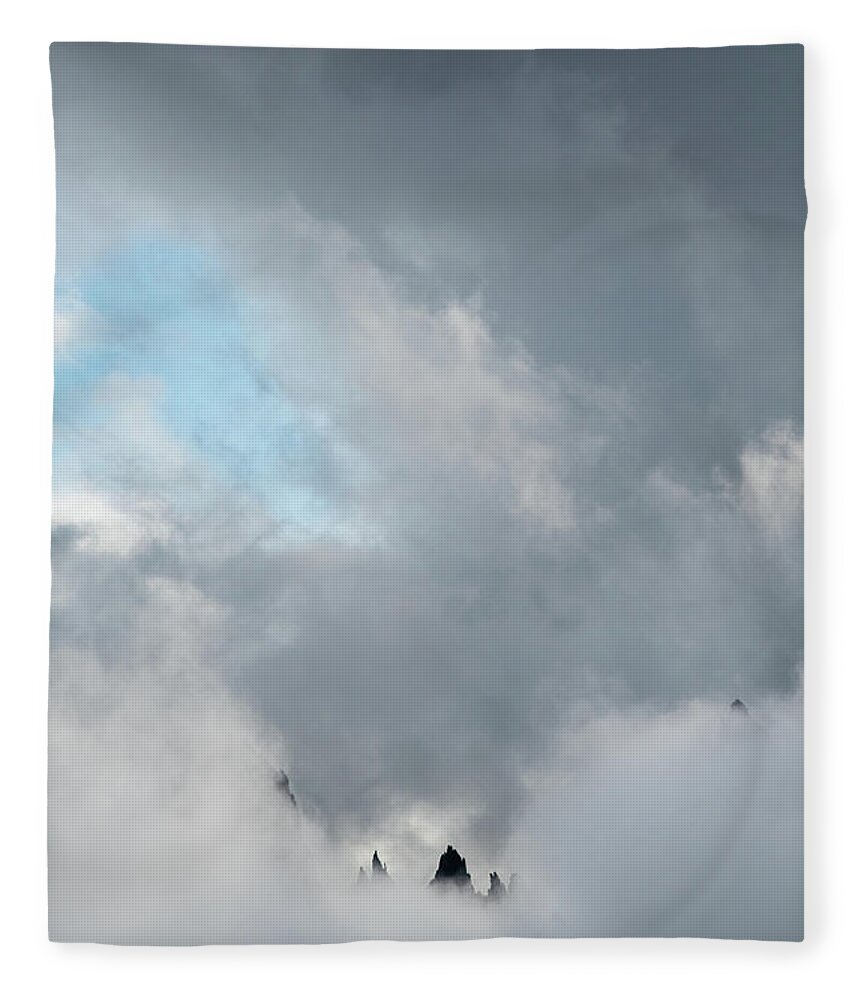 Italian Alps Fleece Blanket featuring the photograph Cloudy landscape with edge of rocky mountains between the stormy sky by Michalakis Ppalis