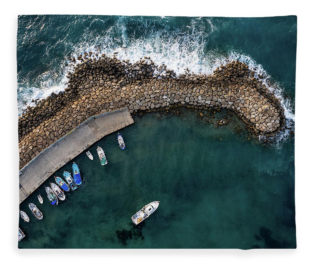 Fishing Harbor Fleece Blanket featuring the photograph Drone aerial fishing harbour with boats stormy waves, blue sea by Michalakis Ppalis