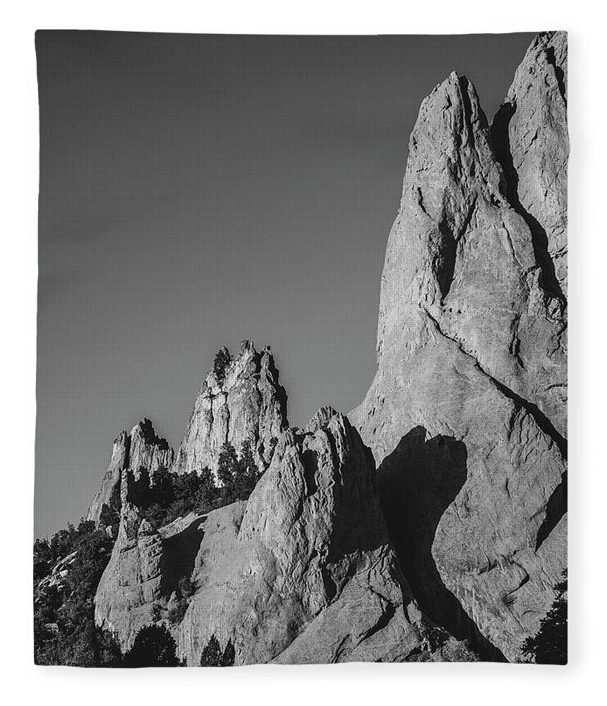 Garden Of The Gods Rock Pinnacles Fleece Blanket featuring the photograph Garden Of Gods Black And White by Dan Sproul