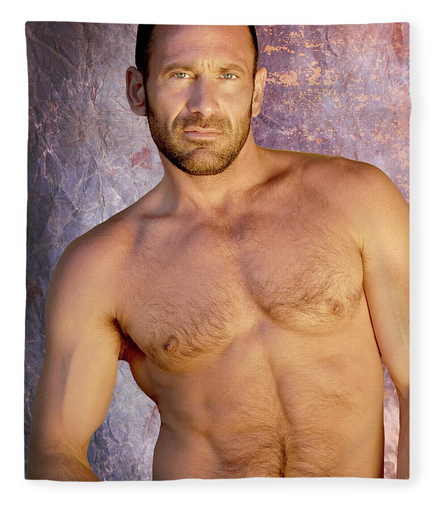 Homoerotic Fleece Blanket featuring the photograph Handsome and muscular man poses for a studio portrait showing that he is in great muscular body. by Gunther Allen