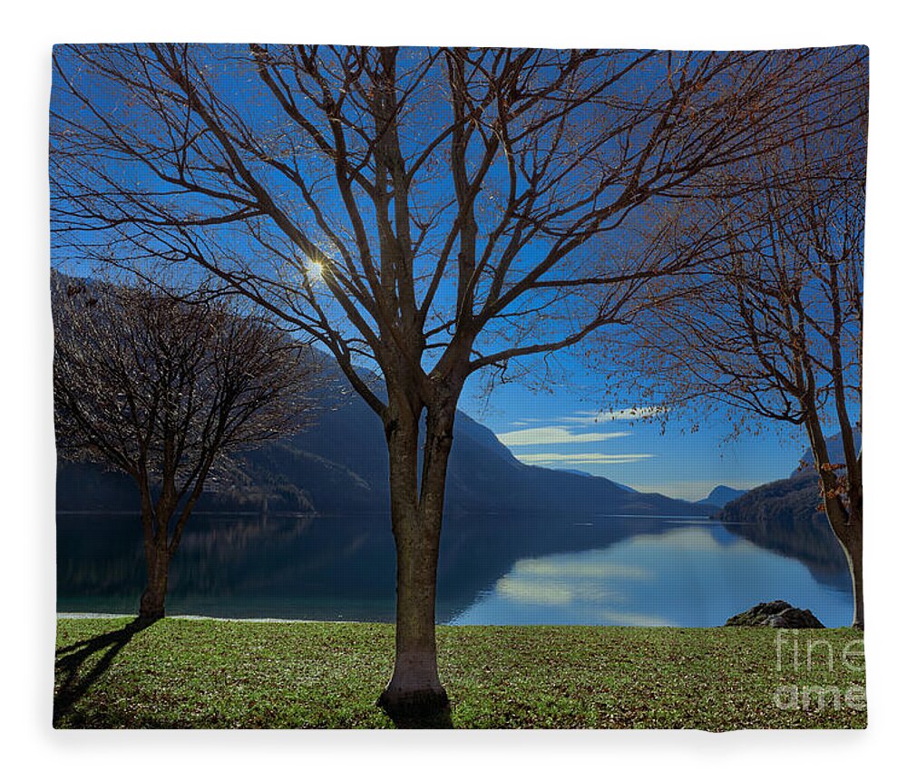 Lake Fleece Blanket featuring the photograph The lake looks peacefully by The P