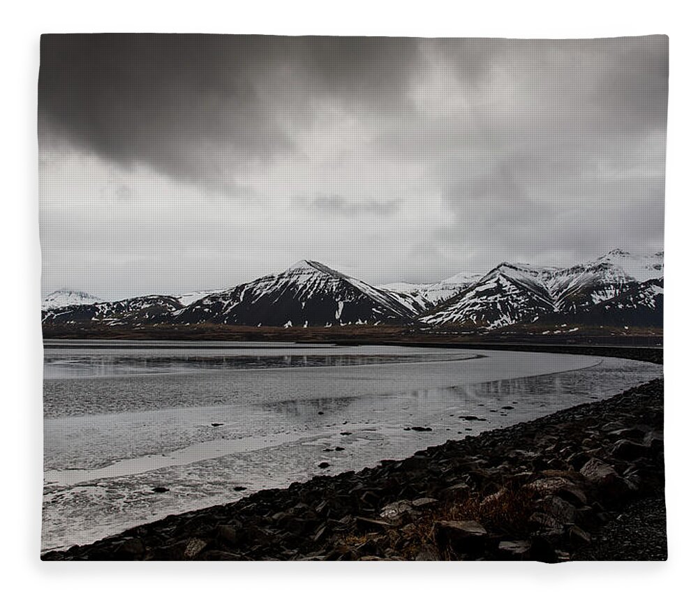 Iceland Fleece Blanket featuring the photograph Icelandic landscape with frozen lake and mountains covered in snow by Michalakis Ppalis