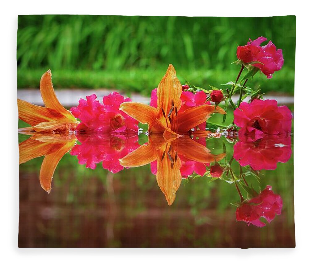 Orange Fleece Blanket featuring the photograph Lilies and Roses Reflection by Jason Fink