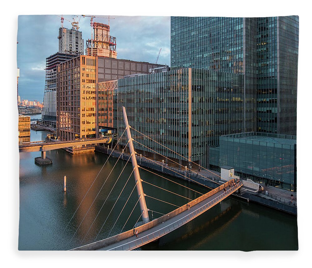 Canary Wharf Fleece Blanket featuring the photograph Modern office building in the Canary Wharf financial centre in the evening. London united kingdom by Michalakis Ppalis