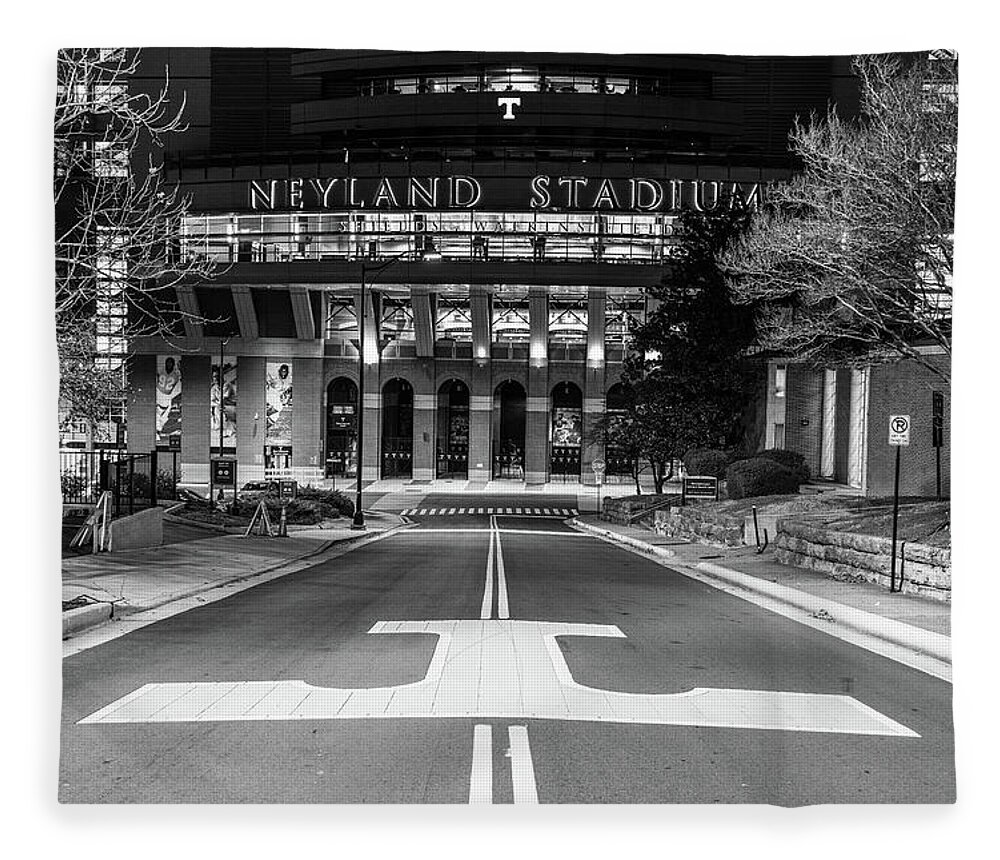 University Of Tennessee At Night Fleece Blanket featuring the photograph Neyland Stadium at the University of Tennessee at night in black and white by Eldon McGraw