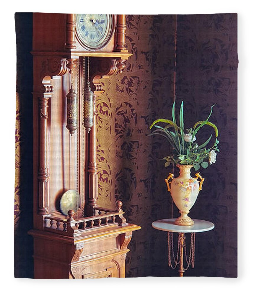 Antique Fleece Blanket featuring the photograph Old fashioned grandfather clock and antique vase by Mendelex Photography
