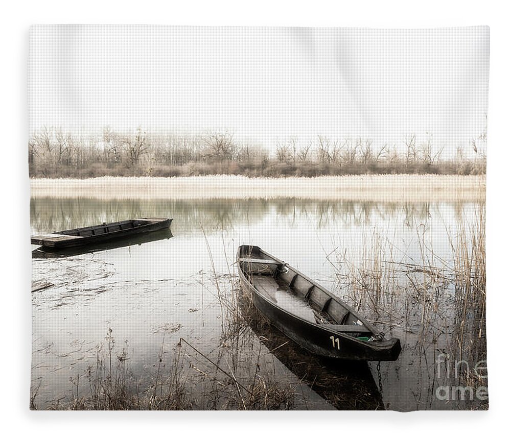 Abandoned Fleece Blanket featuring the photograph Old Wooden Boats Anchored In Calm Mystic Lake by Andreas Berthold