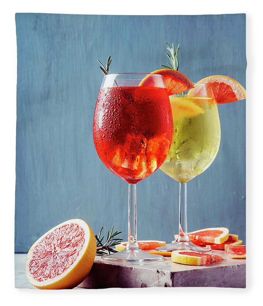 Aperol Fleece Blanket featuring the photograph Red and white aperol spritz garnish in wine glasses by Jelena Jovanovic