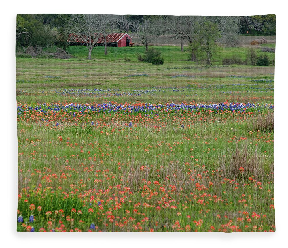 Texas Bluebonnets Fleece Blanket featuring the photograph Red Barn and Spring Flowers by Johnny Boyd