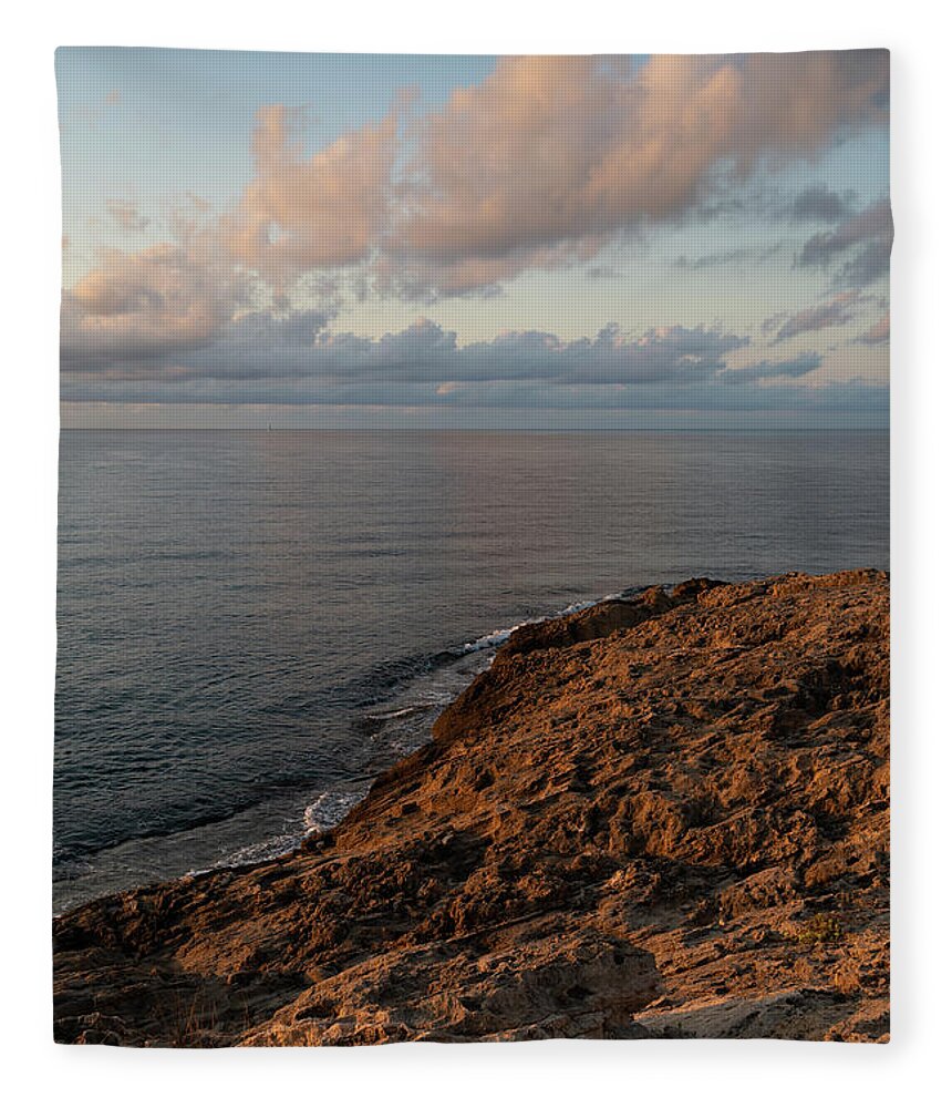 Mediterranean Sea Fleece Blanket featuring the photograph Red-brown rocks and pink clouds on the Mediterranean Sea by Adriana Mueller